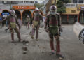 Kenyan anti-riot police clear a barricade from the street after repelling protestors along Moi avenue during demonstrations called after a nationwide deadly protest against a controversial now-withdrawn tax bill left over 20 dead in downtown Nairobi, on June 27, 2024. Kenyans are preparing to take to the streets on Thursday for a white march the day after President William Ruto announced the withdrawal of the draft budget providing for tax increases, at the origin of a protest which foundered in murderous violence. (Photo by Tony KARUMBA / AFP)