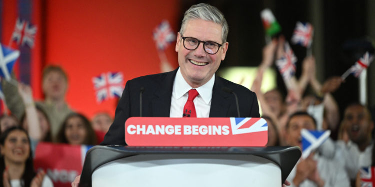 Britain's Labour Party leader Keir Starmer delivers a speech during a victory rally at the Tate Modern in London early on July 5, 2024. The UK's Labour Party swept to power after winning the country's general election, crossing the 326-seat threshold for a working majority in the House of Commons. (Photo by JUSTIN TALLIS / AFP)