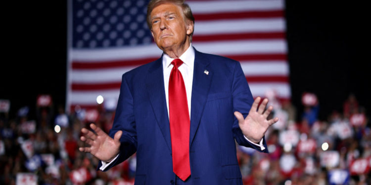 Republican presidential nominee and former U.S. President Donald Trump attends a campaign rally in Novi, Michigan, U.S. October 26, 2024. REUTERS/Carlos Barria