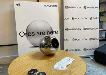 FILE PHOTO: Stickers handed out to people who signed up for WorldCoin are seen at a sign-up site in Shoreditch, East London, Britain July 24, 2023. REUTERS/Elizabeth Howcroft/File Photo