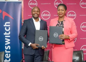 Interswitch Head of Sales & Market Daniel Kiriungi (left) and Absa Business Banking Director Elizabeth Wasunna display MOUs after assenting to a partnership to provide SMEs with Online Tax Invoice Management System (TIMS) devices.