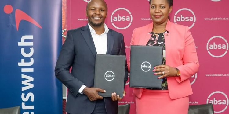 Interswitch Head of Sales & Market Daniel Kiriungi (left) and Absa Business Banking Director Elizabeth Wasunna display MOUs after assenting to a partnership to provide SMEs with Online Tax Invoice Management System (TIMS) devices.