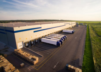 distribution warehouse with trucks of different capacity.