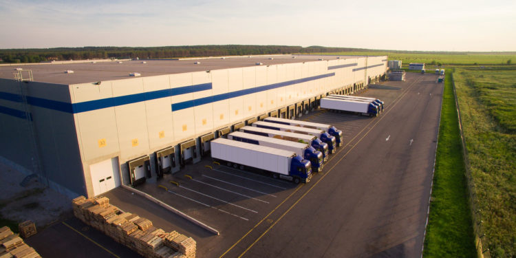 distribution warehouse with trucks of different capacity.