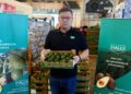 Halls Fresh Produce China Executive Mr Lifan Yu displays a Kakuzi premium Hass Avocados carton at the Shanghai Huizhan Fruit and Vegetable Market on 04082022