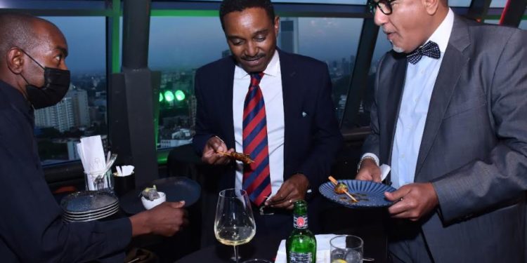 Tourism CS Najib Balala tries out part of the delicacies presented during the launch of the Nairobi Gatronomy experience