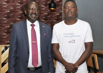 Raila Odinga with Bradox Osumo