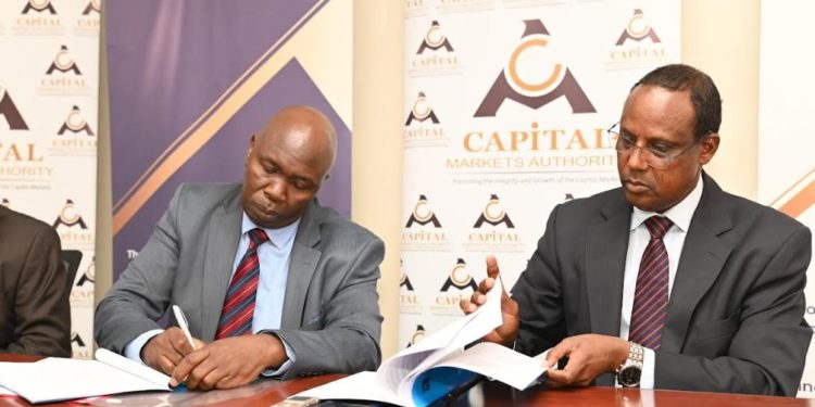 KDC Director General Mr. Christopher Huka and Capital Markets Authority (CMA) Chief Executive Officer Mr. Wyckliffe Shamiah during the signing of the Memorandum of Understanding.