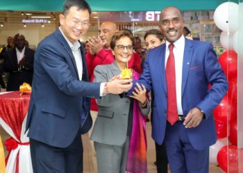 Diamond Trust Bank (DTB) Kenya customer James Pan (left) joins DTB Group Chief Executive Officer Nasim Devji and Chairperson Linus Gitahi (right) at the official opening of the new DTB Imaara Branch.