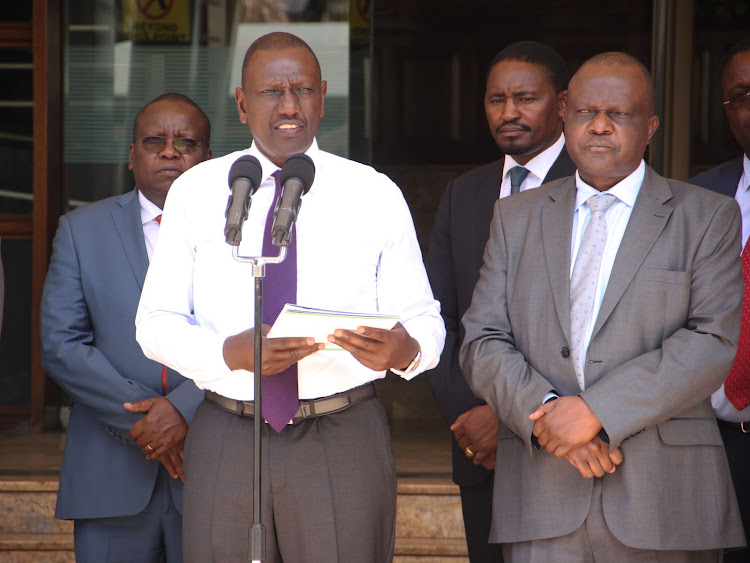 President William Ruto with NDMA CEO James Oduor