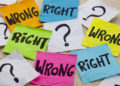 wrong or right dilemma or ethical question - handwriting on colorful sticky notes