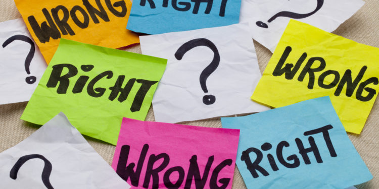 wrong or right dilemma or ethical question - handwriting on colorful sticky notes