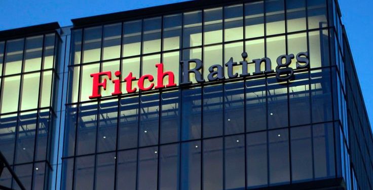 A sign for the financial agency Fitch Ratings Ltd., located within 30 North Colonnade, is seen on a building at the Canary Wharf business and shopping district in London, U.K., on Thursday, March 1, 2012. Moody?s Investors Service said Feb. 14 that Britain may lose its Aaa credit rating. Photographer: Matt Lloyd/Bloomberg via Getty Image