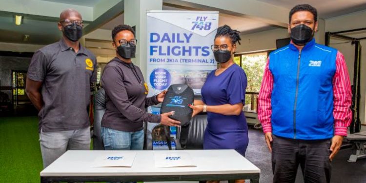 From left to right Team tri fit led by team manager , Michael Owora & Wangui Maranga, from Fly 748, Schedule Services Manager Alijan Merdin & Customer Service Manager, Angel Kamae.