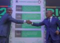 KCB Group CEO Paul Russo left, together with Safaricom PLC CEO Peter Ndegwa after signing the climate commitment act at the Michael Joseph Centre today during the Safaricom Sustainable Business report launch.