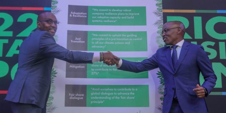 KCB Group CEO Paul Russo left, together with Safaricom PLC CEO Peter Ndegwa after signing the climate commitment act at the Michael Joseph Centre today during the Safaricom Sustainable Business report launch.