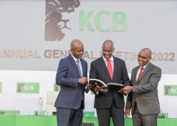 From Left: KCB Group Chief Financial Officer, Lawrence Kimathi, Group Chairman Andrew Wambari Kairu and Group CEO Mr. Paul Russo peruse through the 2021 Integrated Report during the bank's 51st Annual General Meeting conducted virtually. During the meeting, shareholders approved KShs. 9.64 billion total dividends pay-out for the 2021 financial year.