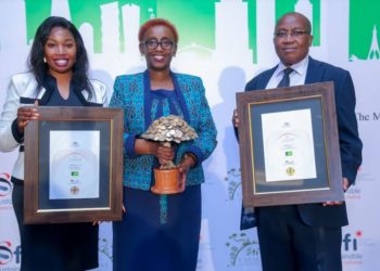 Judith Sidi Odhiambo, Head Of Corporate Affairs and Sustainability at KCB, Charllotte Obado, Sustainability Coordinator at KCB, and Jacob Unda, Senior Manager of Credit Quality and Policy Management at KCB, pose for a photo with their best Sustainable Finance strategy during the Catalyst Awards.