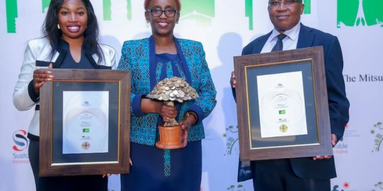 Judith Sidi Odhiambo, Head Of Corporate Affairs and Sustainability at KCB, Charllotte Obado, Sustainability Coordinator at KCB, and Jacob Unda, Senior Manager of Credit Quality and Policy Management at KCB, pose for a photo with their best Sustainable Finance strategy during the Catalyst Awards.