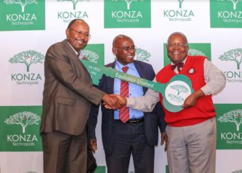 Arch. Dr. Reuben Mutiso, Chairman, KoTDA (right) presents a dummy key to investors from Equisolar Ltd