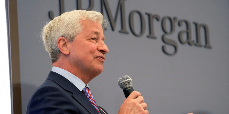 FILE PHOTO: JP Morgan CEO Jamie Dimon delivers a speech during the inauguration the new French headquarters of JP Morgan bank in Paris, France June 29, 2021.  Michel Euler/Pool via REUTERS