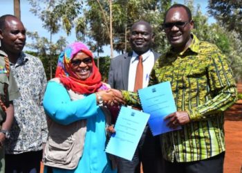 State Department of Correctional Services PS Ms. Safina Kwekwe and Ministry of Environment and Forestry PS Dr. Chris Kiptoo exchange signed agreements kickstarting the planting of the seedlings in 43 prisons across the country ahead of the long rains.