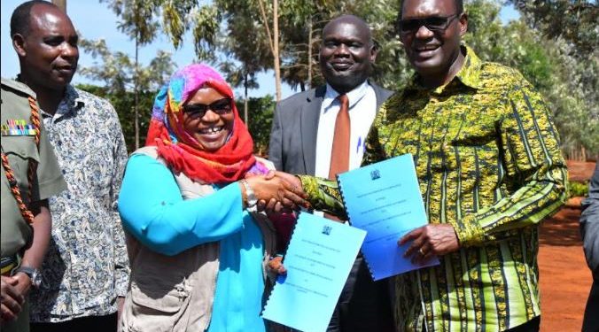 State Department of Correctional Services PS Ms. Safina Kwekwe and Ministry of Environment and Forestry PS Dr. Chris Kiptoo exchange signed agreements kickstarting the planting of the seedlings in 43 prisons across the country ahead of the long rains.