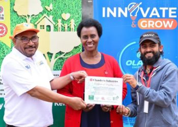 OLA Energy Kenya General Manager Dr. Yousef Elhemmali (L), Muthaiga Primary School Head teacher Lydia Ruguru and Chandaria Industries representative Chetankumar Patel hold a certificate of recycling issued to Muthai