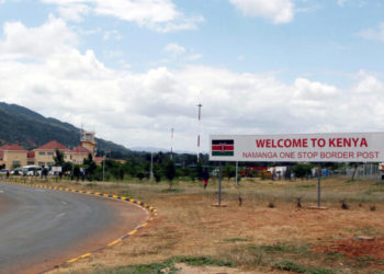 A signage is seen at the border crossing point between Kenya and Tanzania in Namanga, Tanzania July 19, 2019. Picture taken July 19, 2019. REUTERS/Njeri Mwangi - RC1B24DD7490