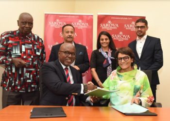 Sarova Hotels Group Managing Director, Jimi Kariuki (front left) and Munira Gilani (front right), exchange signed copies of the management agreement that will see Sarova Hotels managing the Kisumu-based property as Sarova Imperial Hotel. Joining the two executives to commemorate the new partnership are (from back left to right) the Chairman Sarova Hotels, Hon. John Ngata Kariuki, Chairman Imperial Hotel Amin Gilani, Dr Fatimah Gilani and Director Sarova Hotels, Saveer Singh Vohra.