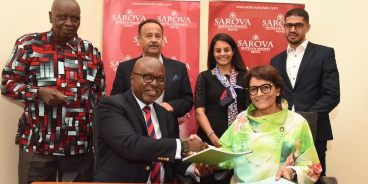 Sarova Hotels Group Managing Director, Jimi Kariuki (front left) and Munira Gilani (front right), exchange signed copies of the management agreement that will see Sarova Hotels managing the Kisumu-based property as Sarova Imperial Hotel. Joining the two executives to commemorate the new partnership are (from back left to right) the Chairman Sarova Hotels, Hon. John Ngata Kariuki, Chairman Imperial Hotel Amin Gilani, Dr Fatimah Gilani and Director Sarova Hotels, Saveer Singh Vohra.