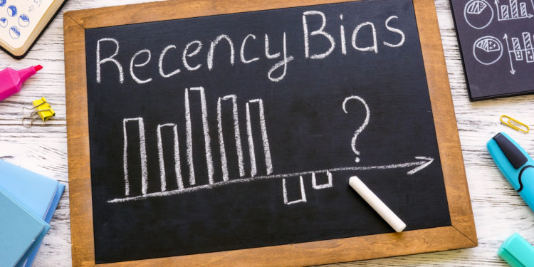 A Small blackboard with chart about recency bias.