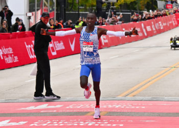 Oct 8, 2023; Chicago, IL, USA;  Kelvin Kiptum of Kenya crosses the finish line of the 2023 Chicago Marathon with a new world record time of 2:00:35. Mandatory Credit: Jamie Sabau-USA TODAY Sports