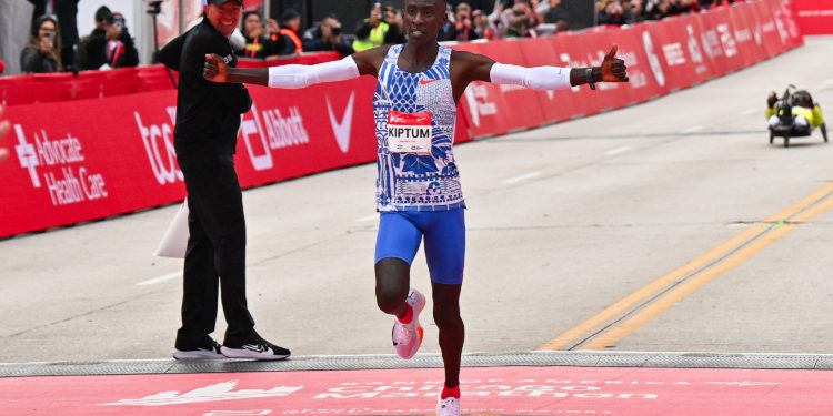 Oct 8, 2023; Chicago, IL, USA;  Kelvin Kiptum of Kenya crosses the finish line of the 2023 Chicago Marathon with a new world record time of 2:00:35. Mandatory Credit: Jamie Sabau-USA TODAY Sports