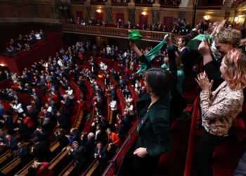 Mps and senators applaud after President of the National Assembly Yael Braun-Pivet announced the result of the vote during the convocation of a congress of both houses of parliament in Versailles, southwestern of Paris, on March 4, 2024, to anchor the right to abortion in the country's constitution. If congress approves the move, France will become the only country in the world to clearly protect the right to terminate a pregnancy in its basic law. (Photo by EMMANUEL DUNAND / POOL / AFP) (Photo by EMMANUEL DUNAND/POOL/AFP via Getty Images)