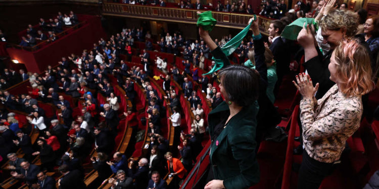 Mps and senators applaud after President of the National Assembly Yael Braun-Pivet announced the result of the vote during the convocation of a congress of both houses of parliament in Versailles, southwestern of Paris, on March 4, 2024, to anchor the right to abortion in the country's constitution. If congress approves the move, France will become the only country in the world to clearly protect the right to terminate a pregnancy in its basic law. (Photo by EMMANUEL DUNAND / POOL / AFP) (Photo by EMMANUEL DUNAND/POOL/AFP via Getty Images)