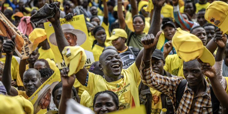 Supporters of Ugandas incumbent president and National Resistance Movement (NRM) presidential candidate Yoweri Museveni celebrate during a party gathering for the announcement of final results for the 2026 Ugandan presidential election at Lugogo Grounds in Kampala on January 17, 2026. Uganda's President Yoweri Museveni, 81, won a seventh term in office on on January 17, 2026 with 71.65 percent of the vote, the country's Electoral Commission said. (Photo by Luis TATO / AFP)