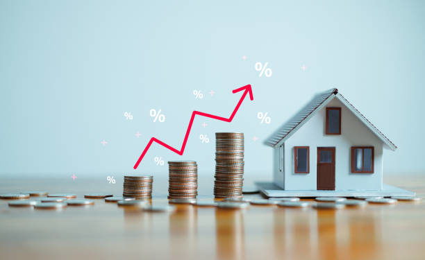 The up arrow shows the inflation rate. Interest rates increase, home loan, mortgage, house tax. investment and asset management concept. percentage for increasing interest rates with stacks coins