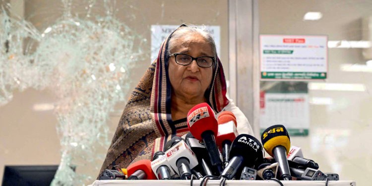 (FILES) In this handout photograph taken and released on July 25, 2024 by Bangladesh Prime Minister's Office, Prime Minister Sheikh Hasina addresses the media at a vandalized metro station in Mirpur, after the anti-quota protests. Thousands of Bangladeshi protesters stormed the palace of Prime Minister Sheikh Hasina in Dhaka on August 5, after a source told AFP she had fled mass demonstrations demanding she quit. (Photo by Bangladesh Prime Minister's Office / AFP) / XGTY / RESTRICTED TO EDITORIAL USE - MANDATORY CREDIT "AFP PHOTO /Bangladesh Prime Minister's Office" - NO MARKETING NO ADVERTISING CAMPAIGNS - DISTRIBUTED AS A SERVICE TO CLIENTS