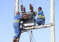 Kenya power technicians install a transformer at Ibutuka Village in Mbeere North in Embu County (Murithi Mugo, Standard)
