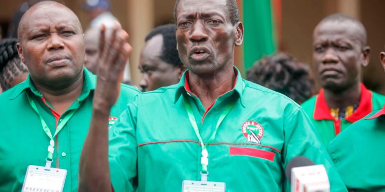 KNUT Secretary General Collins Oyuu addresses journalists at the Citam Auditorium in Kisumu County on December 13, 2022. Mr Oyuu said they will discuss various national interest issues such as CBC review, promotion of teachers, delocalization and teachers' pay rise during their 62nd Annual Delegates Conference. Photo/Tonny Omondi