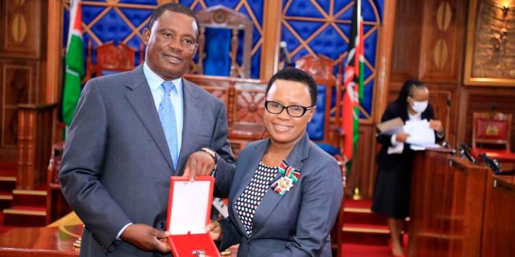 Speaker of the National Assembly Justin Muturi  [L] confers Deputy Clerk, National Assembly Sarah Kioko with Moran of the Burning Spear (MBS) in this photo taken on May 17, 2022 at parliament buildings that was awarded by President Uhuru Kenyatta in recognition of distinguished and outstanding service rendered to the nation and the word in various capacities and responsibilities.
Photo | Jeff Angote | Nation