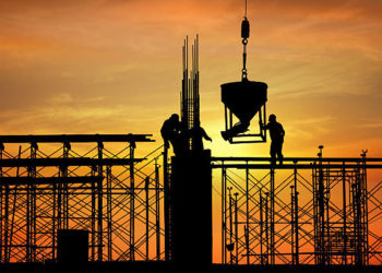 silhouette of construction worker on construction site