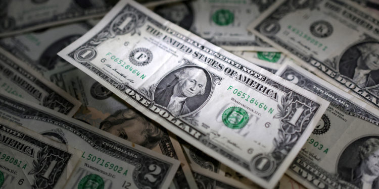 FILE PHOTO: U.S. dollar banknotes are seen in this illustration taken March 10, 2023. REUTERS/Dado Ruvic/Illustration